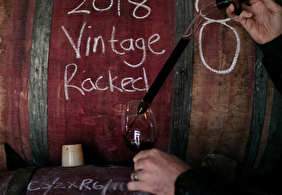 Winemaker Duncan Clarke Doing tastigs out of barrels