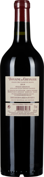 Dunkle Weinflasche mit rotem Wachsverschluss und cremefarbenem Etikett.