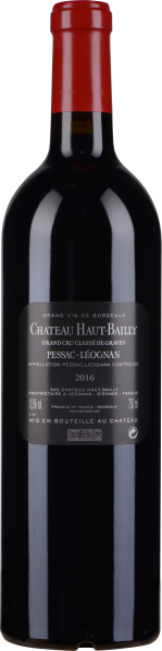 Weinflasche mit dunkelrotem Etikett und leuchtend rotem Kapselverschluss.