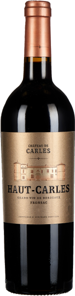 Dunkle Weinflasche mit bronzefarbenem Etikett und kräftiger roter Kapsel.