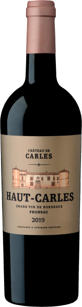 Weinflasche mit cremefarbenem Etikett und gezeichnetem Châteaumotiv.