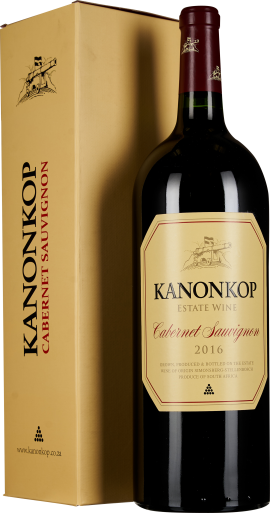 Große, dunkle Weinflasche mit gelbem Etikett und passender Geschenkbox.