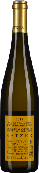 Schlanke Weinflasche mit goldener Kapsel und gelbem Etikett.