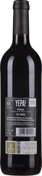 Dunkelroter Wein in einer eleganten, schlanken Glasflasche mit schlichtem Etikett.