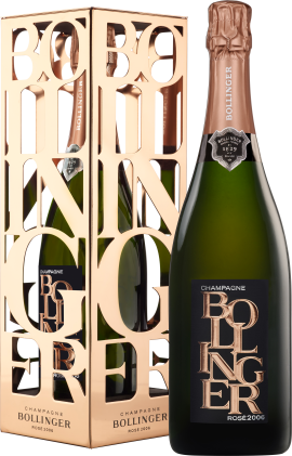 Grüne Champagnerflasche mit kupferfarbener Verpackung und elegantem Etikettendesign.