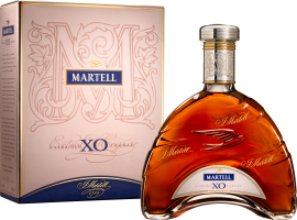 Elegante, geschwungene Flasche mit rötlich-goldenem Inhalt und dekorativem Karton.