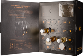 Schwarzer Adventskalender mit Schiebefächern und Mini-Rumflaschen, edel gestaltet.