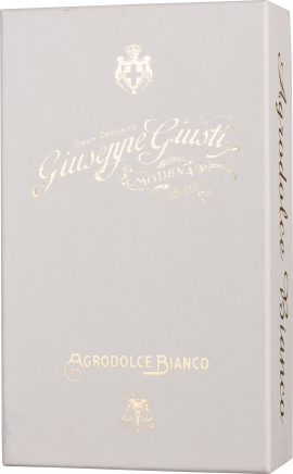 Elegante, cremefarbene Verpackung mit goldener Schrift und Wappen.