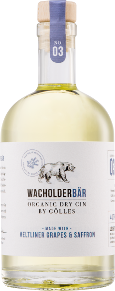 Flasche mit hellem Gin, blauer Holzkorken, illustriertem Bär auf dem Etikett.