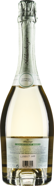 Klare, elegante Sektflasche mit silberner Folie und grüner Etikettierung.