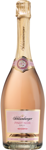 Roséfarbene Sektflasche mit goldener Kapsel und eleganten Etiketten.