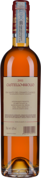 Durchscheinender Honigfarbener Wein in schlanker, eleganter Flasche.