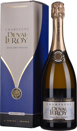 Schwarze Champagnerflasche mit goldener Kapsel, elegante Geschenkbox daneben.