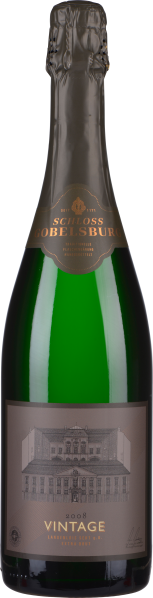 Grüne Sektflasche mit goldener Schrift und Schloss-Abbildung auf Etikett.