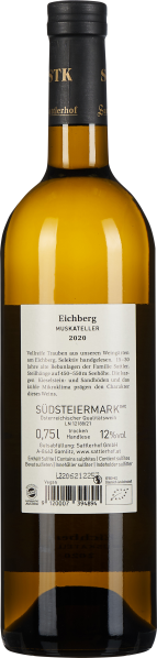 Klarglas-Weinflasche mit goldgelbem Inhalt, schlichtes schwarz-weißes Etikett.