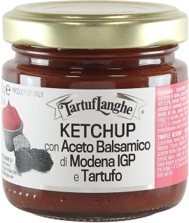 Kleine Glasflasche mit goldenem Deckel, enthält roten Ketchup, elegantes Etikett.