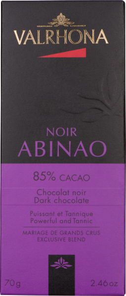 Schwarze und lila Schokoladenverpackung mit stilisiertem Logo, elegantes Design.