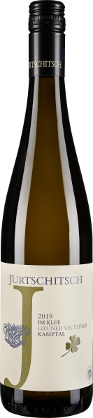 Weinflasche mit olivgrünem Etikett, Klee-Symbol und schwarzer Kapsel.