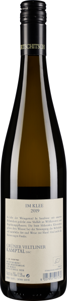 Grün-goldene Weinflasche mit schwarzem Verschluss und cremefarbenem Etikett.