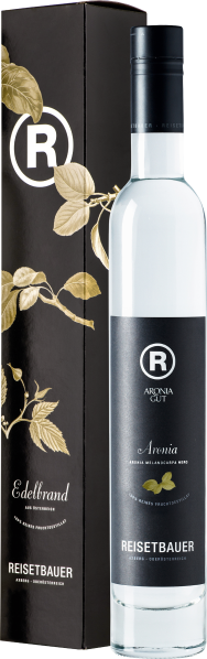 Klare Flasche mit schwarzem Etikett und passender schwarzer Geschenkbox.