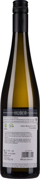 Schlanke, grünlich-gelbe Flasche mit schwarzem Schraubverschluss.