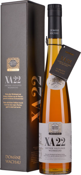 Schlanke, bernsteinfarbene Flasche mit schwarzem Verschluss neben eleganter Verpackung.