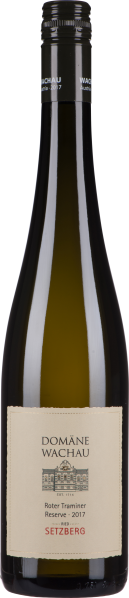 Dunkle Weinflasche mit schlichtem cremefarbenem Etikett und schwarzem Schraubverschluss.