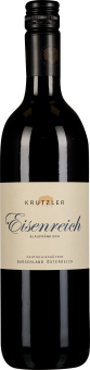 Eine schlanke Weinflasche mit dunkelroter Flüssigkeit, schwarzem Schraubverschluss und einem cremefarbenen Etikett mit eleganter Schrift.