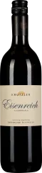 Eine schlanke Weinflasche mit dunkelroter Flüssigkeit, schwarzem Schraubverschluss und einem cremefarbenen Etikett mit eleganter Schrift.