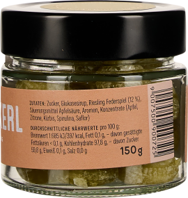 Kleines Glas mit schwarzem Deckel und beige-braunem Etikett, transparentem Inhalt sichtbar.