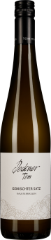 Klare Weißweinflasche mit schwarzem Schraubverschluss und elegantem, schlichtem Etikett in Weiß mit feinen Illustrationen und schwarzer Schrift.