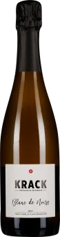 Eine elegante Sektflasche mit dunkler, glänzender Oberfläche, schwarzem Folienverschluss und schlichtem, modernem Etikett.