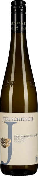 Braun-gelbe Weinflasche mit schlichtem, elegantem Etikett und schwarzem Schraubverschluss.