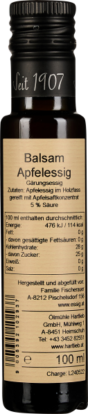 Dunkle Glasflasche mit beigem Etikett und schwarzem Drehverschluss.