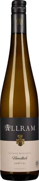 Braune Weinflasche mit schwarzem Etikett und goldenen Verzierungen.