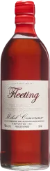 Die Flasche enthält eine bernsteinfarbene Flüssigkeit und hat einen roten Verschluss. Das Etikett ist cremefarben mit einer eleganten Schrift. Die Form der Flasche ist klassisch und klar.