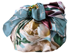 In bunt gemustertem Stoff eingewickelte Colomba mit elegantem Schleifenverschluss.