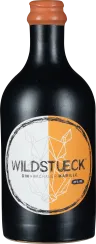 Mattschwarze Flasche mit orange-weißem Etikett und geometrischem Design.