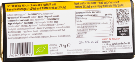Verpackung einer Tafelschokolade mit Nährwertangaben und Zutatenliste, gelb-schwarzes Design.