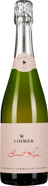 Grüne Flasche mit rosa Etikett und silberner Folienkapsel.