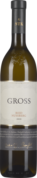 Flasche mit leicht gelblich-grünem Wein, elegantem Etikett in Creme- und Goldtönen und schwarzem Verschluss mit goldener Prägung.