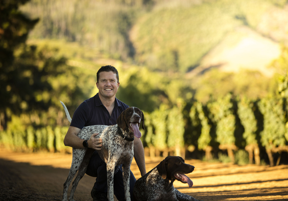 Thelema Commercial Director Thomas Webb with Farm Dogs